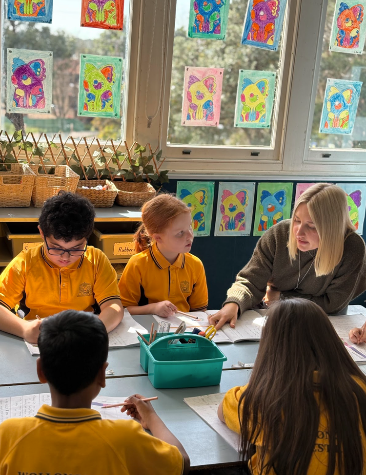 teacher working with a small grouo
