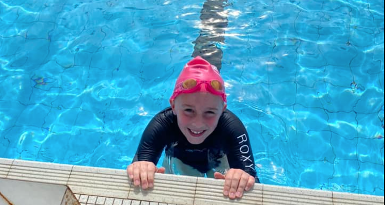 A child in a swimming pool.