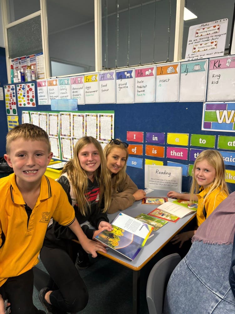 A student sharing her learning with her family.