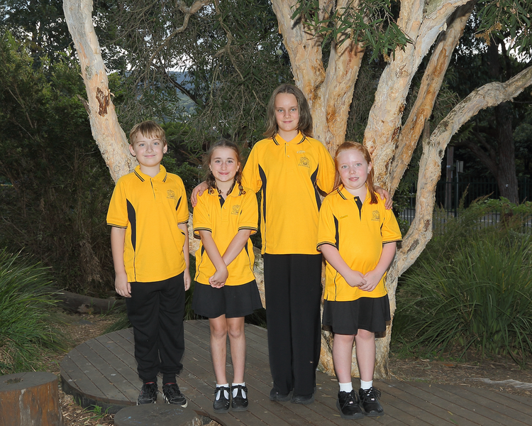 4 students standing in garden