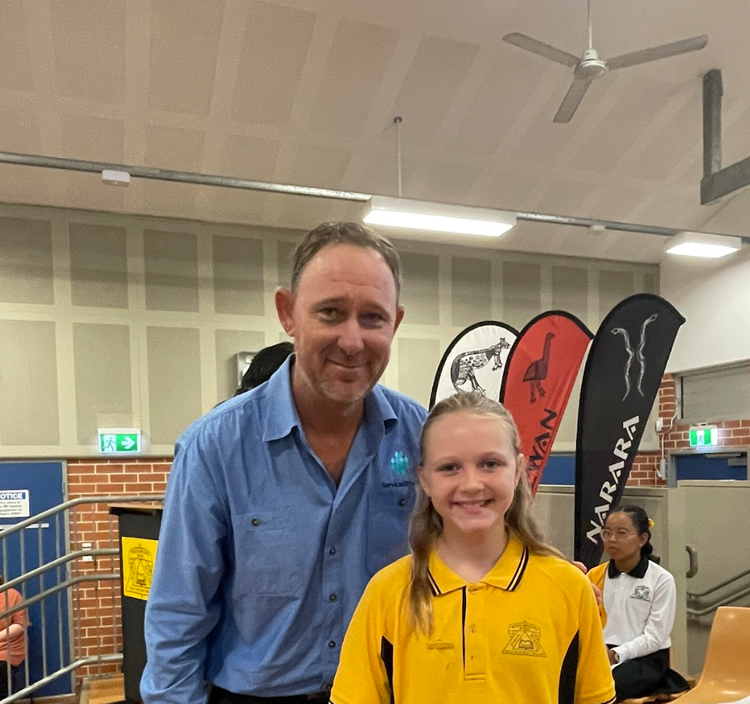father and daughter at an assembly