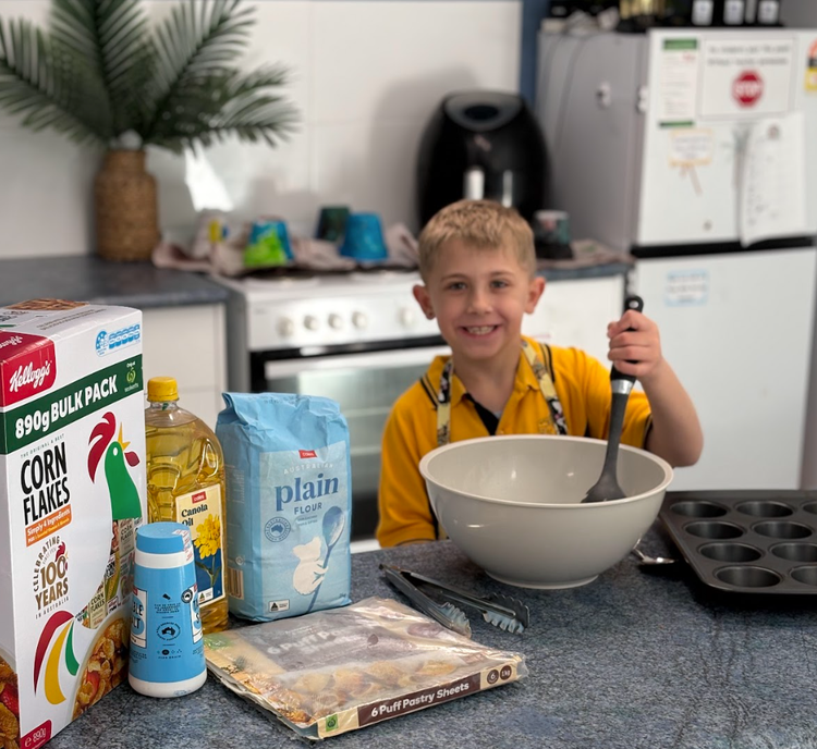 child cooking in kitchen