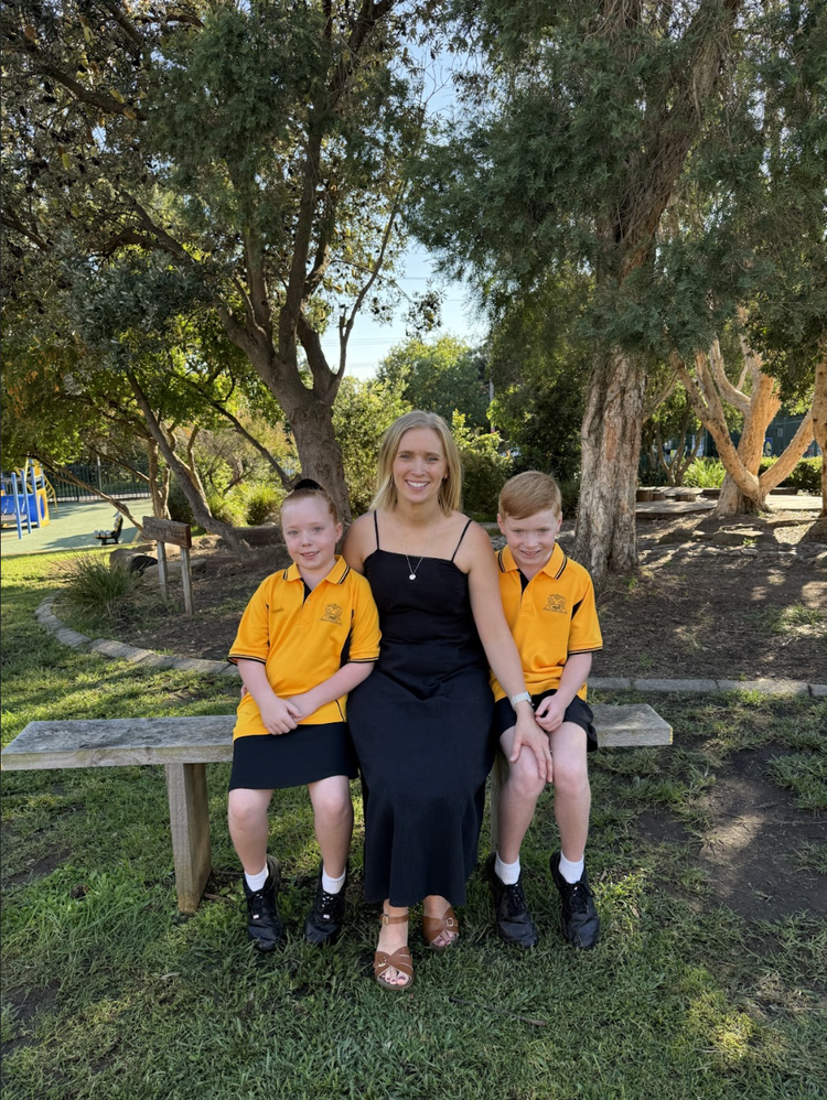 A family sitting outdoors