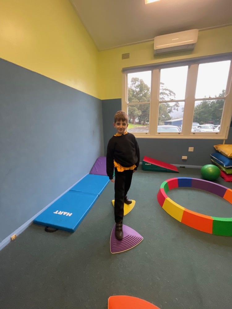 a boy using the circuit room