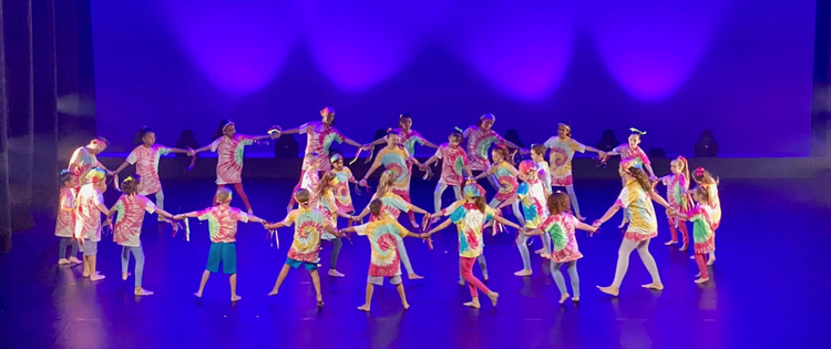 dance troupe performing on stage