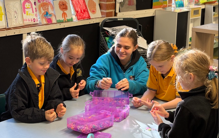 Children with an educator at OOSH