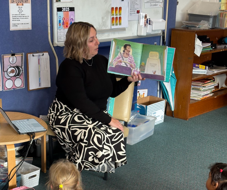 Teacher reading a book