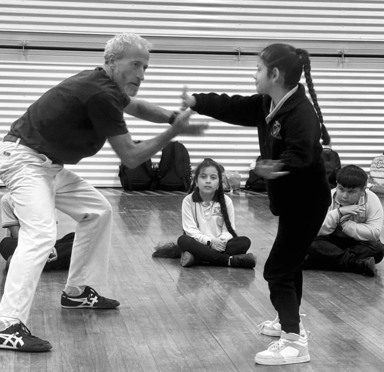 Girl and instructor practicing movement skills