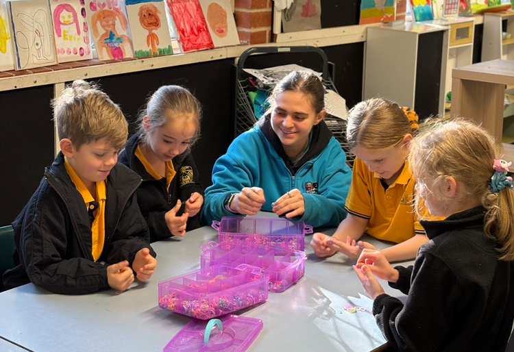 educator supporting children at OOSH