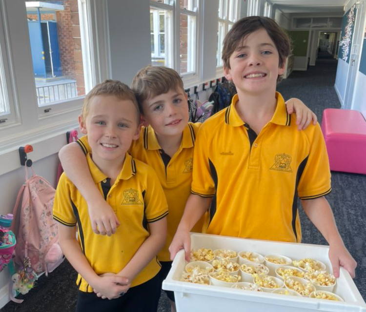 SRC representatives delivering popcorn on a movie day